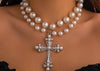 Statement pearl necklaceCross pendant necklaceRhinestone filigree jewelryVintage-inspired pearl jewelryElegant necklace for special occasionsfashion accessoriesstatement necklaceAdjustable pearl necklace with crossGlamorous pearl and rhinestone necklaceFaux pearl cross necklace