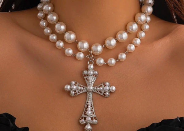 Statement pearl necklaceCross pendant necklaceRhinestone filigree jewelryVintage-inspired pearl jewelryElegant necklace for special occasionsfashion accessoriesstatement necklaceAdjustable pearl necklace with crossGlamorous pearl and rhinestone necklaceFaux pearl cross necklace