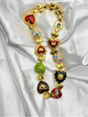 gold-tone heart charm necklacemulticolored heart necklaceenamel heart pendant necklacebold statement necklacewhimsical heart jewelry for womencolorful heart charm necklacetrendy gold-tone necklaceplayful fashion jewelryunique charm necklacewomen’s colorful statement necklace