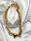 Geometric gold chain necklaceBold statement necklaceChunky gold chainTriangle pendant necklaceModern fashion jewelryEdgy gold necklaceStatement jewelry pieceUnique gold-tone necklace