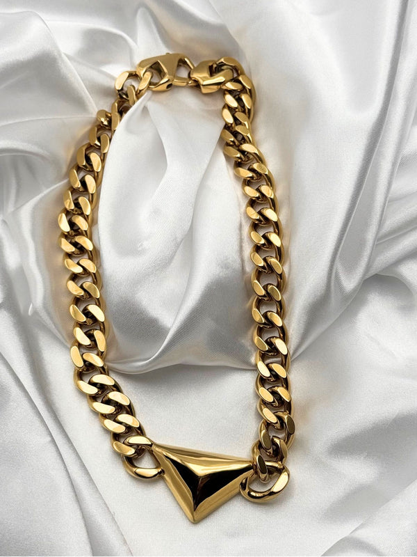 Geometric gold chain necklaceBold statement necklaceChunky gold chainTriangle pendant necklaceModern fashion jewelryEdgy gold necklaceStatement jewelry pieceUnique gold-tone necklace