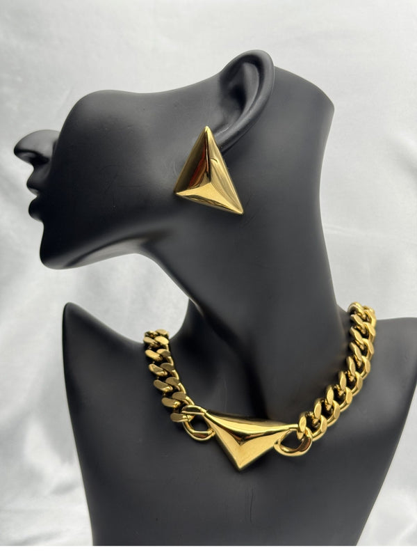 Gold statement jewelry setTriangle necklace and earrings setBold geometric jewelryChunky gold chain necklaceModern statement necklace and earringsFashion-forward jewelry setElegant gold jewelry set