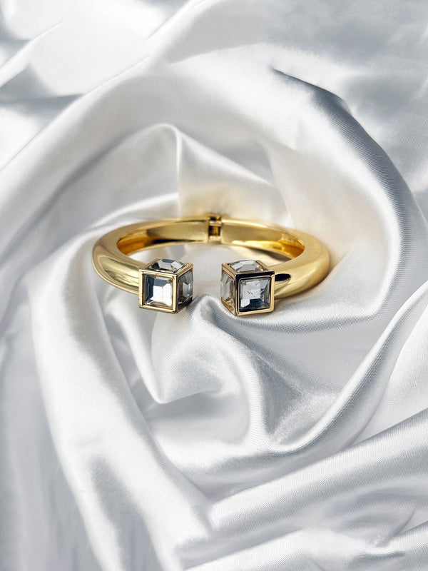 gold bangle bracelet with crystal, square crystal gold bracelet, luxury statement bangle, minimalistic gold jewelry, sophisticated bangle for women, chic gold bracelet, modern crystal cuff