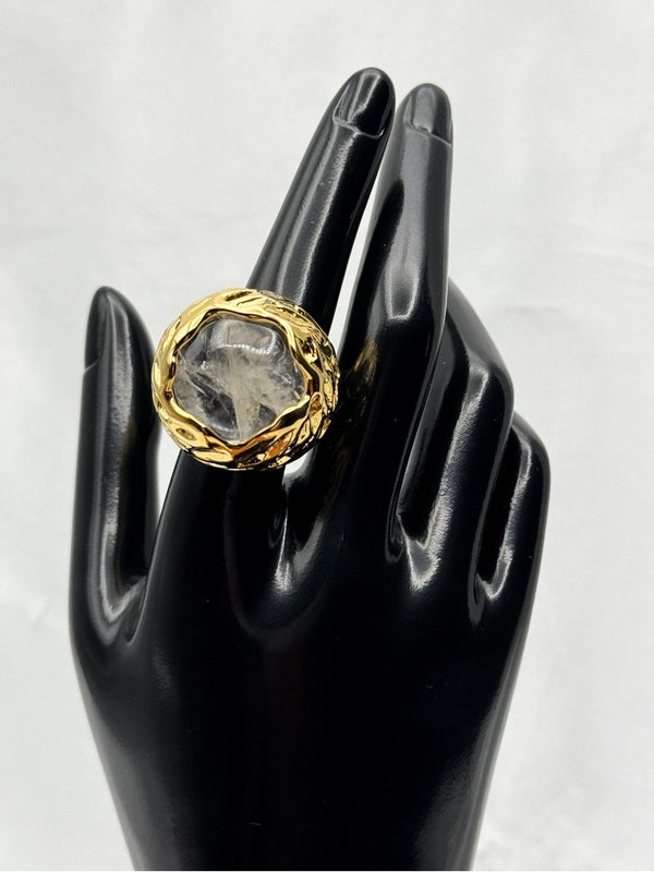 Clear stone encased in intricate, textured gold setting. Earthy feel. bold statement ringone size ringvacation ringdeep blue stonetextured gold settingnatural designunique ring