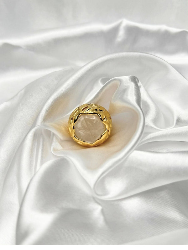 Clear stone encased in intricate, textured gold setting. Earthy feel. bold statement ringone size ringvacation ringdeep blue stonetextured gold settingnatural designunique ring