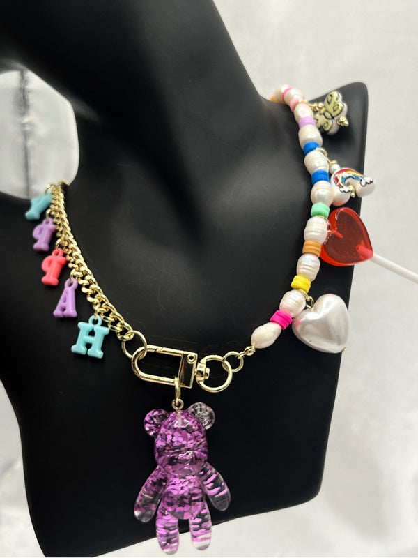 colorful happy charm necklaceplayful teddy bear necklacewhimsical letter charm necklacetrendy bead and pearl necklacefun charm necklace for womenbold statement charm jewelrycolorful bead necklace for womeneclectic charm necklacegold-tone teddy bear pendant necklacejoyful fashion necklaceunique jewelrystatement jewelrystatement necklacechic necklace