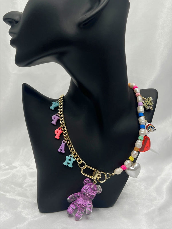 colorful happy charm necklaceplayful teddy bear necklacewhimsical letter charm necklacetrendy bead and pearl necklacefun charm necklace for womenbold statement charm jewelrycolorful bead necklace for womeneclectic charm necklacegold-tone teddy bear pendant necklacejoyful fashion necklaceunique jewelrystatement jewelrystatement necklacechic necklace