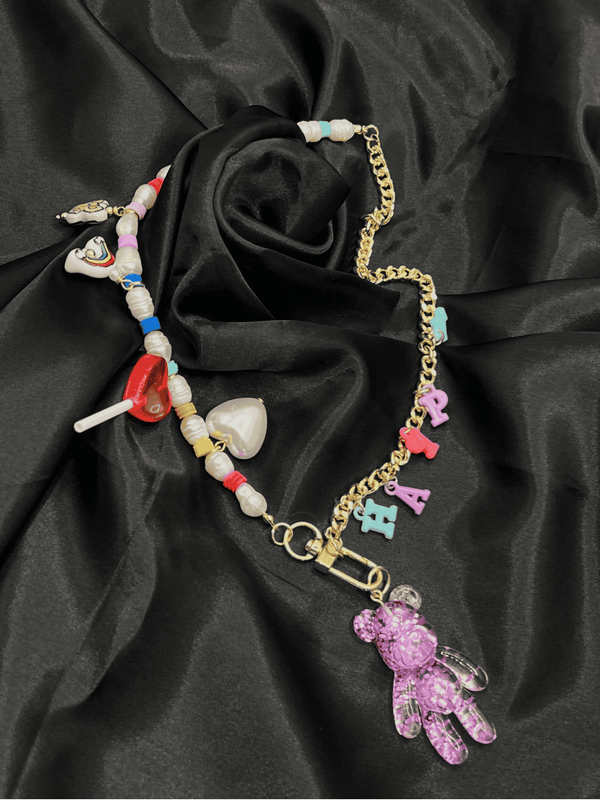 colorful happy charm necklaceplayful teddy bear necklacewhimsical letter charm necklacetrendy bead and pearl necklacefun charm necklace for womenbold statement charm jewelrycolorful bead necklace for womeneclectic charm necklacegold-tone teddy bear pendant necklacejoyful fashion necklaceunique jewelrystatement jewelrystatement necklacechic necklace