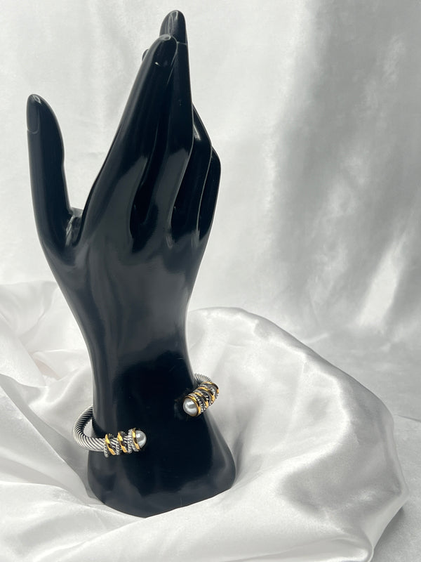 dual-tone bangle, silver and gold bangle, pearl accent bangle, stacked bangles, elegant twist bangle, luxury bangle set, elegant bracelet, classy bracelet