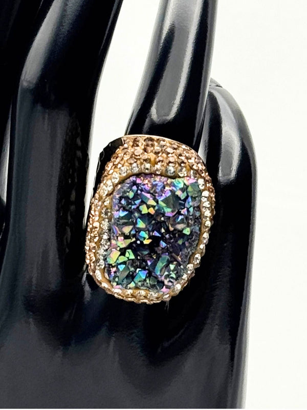 Earthy, reminiscent, bold design, oceanic gray center stone surrounded by textured, gold-toned settingone size fits allstatement ringvacation ring bold ringunique designgold jewelry gold ring earthy ring