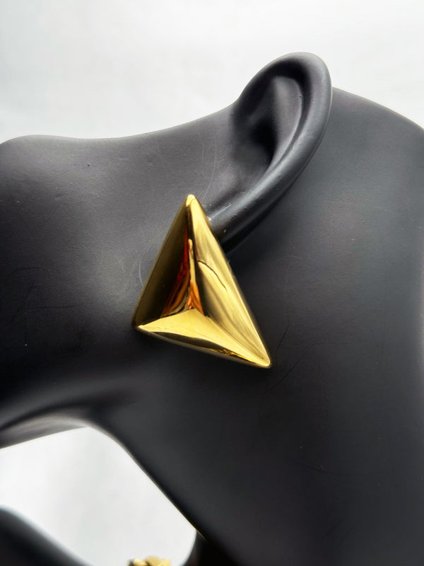 Gold statement earringsPyramid gold earringsBold geometric earringsModern gold earringsEmpowering jewelry for womenFashion earrings goldUnique gold-tone earringsStylish angular earrings