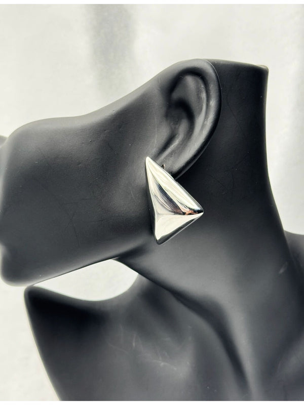 Silverstatement earringsPyramid silver earringsBold geometric earringsModern silver earringsEmpowering jewelry for womenFashion earrings silverUnique silver-tone earringsStylish angular earrings