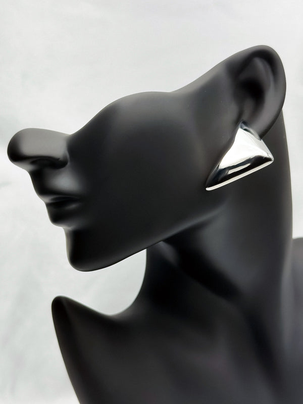 Silverstatement earringsPyramid silver earringsBold geometric earringsModern silver earringsEmpowering jewelry for womenFashion earrings silverUnique silver-tone earringsStylish angular earrings