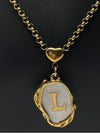 gold-tone initial pendant necklacepersonalized letter necklacewhite enamel initial necklacestylish "L" initial necklaceelegant monogram jewelrywomen’s fashion initial pendanttrendy gold letter necklacepersonalized jewelry for womencustom initial necklacetimeless gold-tone necklace with enamel detailingunique jewelry