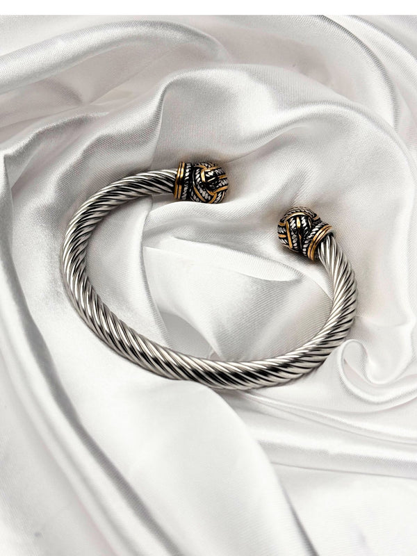 dual-tone bracelet, silver and gold cuff, Iron Grace bracelet, twisted cable bracelet, knot-end bracelet, statement cuff bracelet, elegant two-tone bracelet