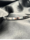 Silver bangle stackFloral motif banglesCrystal embellished braceletsElegant silver jewelryWomen's bangle setFashionable silver-toned banglesSophisticated bracelet stackStylish wrist accessoriesChic silver bangles