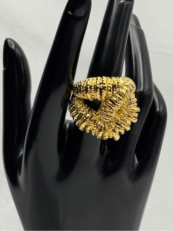 textured gold twist ring. Its intricate design features a twisted, rope-like structure with detailed texture, giving it a unique and eye-catching look. This ring is perfect for those who love chunky, statement jewelry and want to add a touch of luxury to their collection. Ideal for elevating any outfit, whether casual or formal.Gold twist ringTextured gold ringChunky statement ringUnique fashion jewelryBold gold ringLuxury fashion accessoriesTwisted gold ring designStatement ring