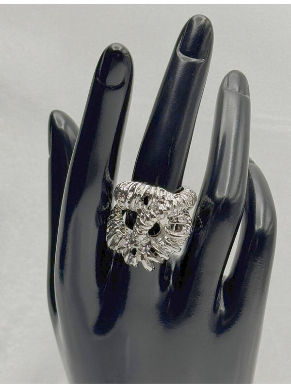 textured silver twist ring. Its intricate design features a twisted, rope-like structure with detailed texture, giving it a unique and eye-catching look. This ring is perfect for those who love chunky, statement jewelry and want to add a touch of luxury to their collection. Ideal for elevating any outfit, whether casual or formal.Silvertwist ringTextured silverringChunky statement ringUnique fashion jewelryBoldsilver ringLuxury fashion accessoriesTwisted silver ring designStatement ring