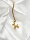 gold-tone balloon dog necklaceplayful dog pendant necklacewhimsical gold jewelryfun statement necklace for womenquirky animal pendant necklacetrendy gold-tone accessoriesunique fashion necklacewomen’s gold dog necklacegift jewelry for dog loversminimalist gold-tone necklaceunique necklacemodern jewelrychic jewelry