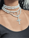 Layered pearl necklaceVersatile detachable necklaceSilver cross pendant necklaceElegant three-in-one jewelryMulti-chain statement necklacePearl choker with cross pendantVintage-inspired layered necklaceSophisticated women's jewelryAdjustable pearl necklace setTimeless layered jewelry piece
