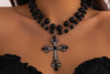 Gothic cross necklacecross necklaceBlack beaded pendant necklaceVintage cross jewelryStatement cross pendantDouble strand black necklaceGothic fashion accessoriesFiligree cross pendant necklaceElegant black cross necklaceVictorian-inspired jewelryBlack beaded gothic necklace