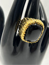 black and gold statement ring featuring a bold, square-shaped black stone framed in a textured gold band, glossy black stone and the intricate gold detailing standout pieceunique, high-impact jewelry.Black and gold statement ringBold black stone ringSquare black stone ringTextured gold ringChunky gold ring