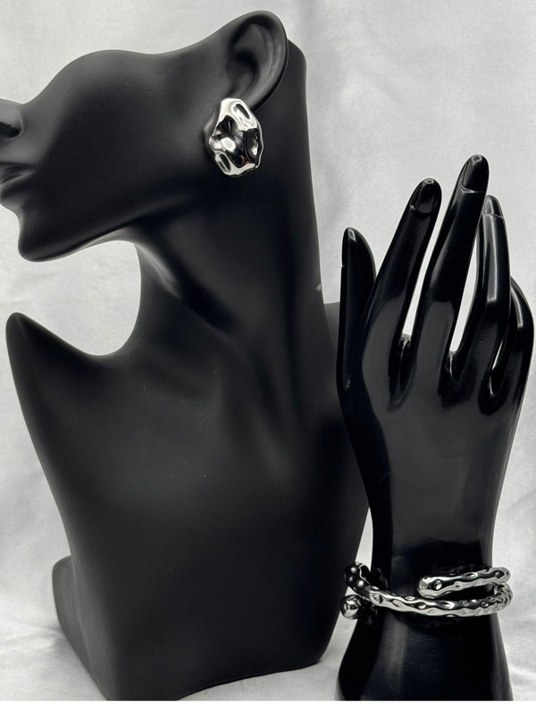 Silver sculpted earringsTwisted silver bangle braceletModern statement jewelry setOrganic shape earringsContemporary silver jewelryBold silver earrings and braceletArtistic jewelry set for women
