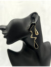 black and gold abstract earrings, modern statement jewelry, artistic drop earrings, wavy silhouette earrings, unique fashion jewelry