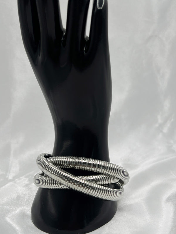 silver coil bracelet, modern silver bracelet, coiled silver jewelry, minimalist silver bangle, bold silver statement bracelet, spiral bracelet in silver, polished silver coil
