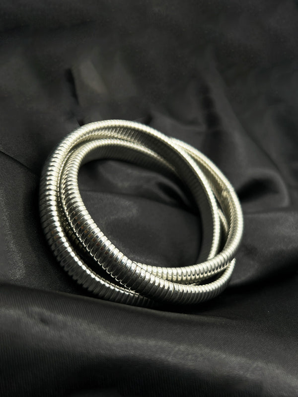 silver coil bracelet, modern silver bracelet, coiled silver jewelry, minimalist silver bangle, bold silver statement bracelet, spiral bracelet in silver, polished silver coil