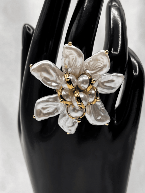 Pearl flower ringStatement floral jewelryGold-tone pearl ringBaroque-inspired statement ringBlooming flower ring designElegant pearl statement pieceWomen’s bold jewelryUnique floral cocktail ringLuxury gold and pearl ringArtistic flower-inspired ringLarge statement pearl ringTrendy pearl jewelryWedding guest accessoriesDesigner floral ringHandcrafted pearl jewelry