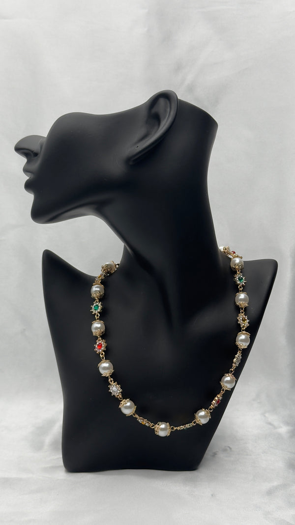 Pearl and gemstone necklaceRegal collar necklaceStatement pearl jewelryGold-tone formal necklaceGemstone-accented pearl necklaceLuxury evening accessoryElegant pearl statement pieceVibrant gemstone necklace for womenSophisticated formal jewelryDesigner-inspired collar necklaceTimeless pearl and gold necklaceWomen’s luxury statement necklaceGemstone charm necklaceWedding and event jewelry