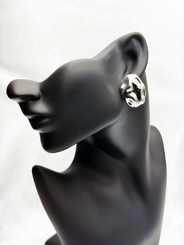 Sculptural silver earringsOrganic shape earringsBold silver statement earringsArtistic silver jewelryUnique silver earrings for womenAvant-garde silver earringsStatement earrings for individualityFluid design silver jewelry