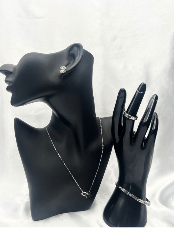 minimalist silver jewelry set, double-ring pendant necklace, Roman numeral bracelet, silver stud earrings, modern jewelry ensemble, sleek silver accessories