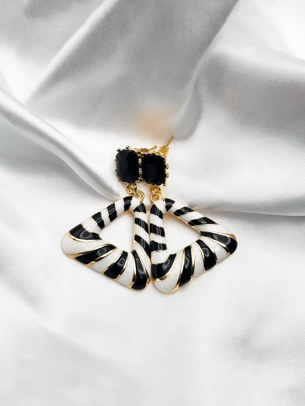 Wild Whisper earringsZebra print earringsBlack and white geometric earringsAnimal print statement earringsTriangular drop earrings for womenBold fashion earrings with zebra patternUnique black stone and animal print earrings