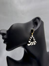 Wild Whisper earringsZebra print earringsBlack and white geometric earringsAnimal print statement earringsTriangular drop earrings for womenBold fashion earrings with zebra patternUnique black stone and animal print earrings