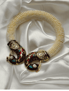Gold-toned braceletpeacock braceletDesigner enamel braceletTraditional jewelryFestive accessoriesWedding braceletLuxury handmade braceletEnamel and rhinestone jewelryUnique braceletFashionable Indian jewelry