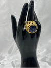 deep bllue stone encased in intricate, textured gold setting. Earthy feel. bold statement ringone size ringdeep blue stonetextured gold settingnatural designunique ring