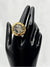 Clear stone encased in intricate, textured gold setting. Earthy feel. bold statement ringone size ringvacation ringdeep blue stonetextured gold settingnatural designunique ring