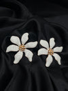  ivory flower earrings, blossom earrings, floral stud earrings, white petal earrings, nature-inspired jewelry, wedding statement earrings, elegant floral jewelry