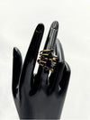 unique artistic jewelryGold-tone band with black cubic stonesIrregular, asymmetrical design for a modern, artistic aestheticPerfect for statement jewelry loversIdeal for special occasions or daily wearGold and black ringIrregular aesthetic ringStatement jewelryBlack stone ringAvant-garde ring designArtistic fashion ringAsymmetrical ringUnique fashion accessoriesBold fashion jewelryModern gold ring with black stones
