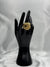 textured gold twist ring. Its intricate design features a twisted, rope-like structure with detailed texture, giving it a unique and eye-catching look. This ring is perfect for those who love chunky, statement jewelry and want to add a touch of luxury to their collection. Ideal for elevating any outfit, whether casual or formal.Gold twist ringTextured gold ringChunky statement ringUnique fashion jewelryBold gold ringLuxury fashion accessoriesTwisted gold ring designStatement ring