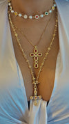 Ruby cross pendantGold-tone cross necklaceElegant religious jewelryLuxury ruby pendantPavé crystal cross designStatement faith jewelryRed gemstone cross necklaceSophisticated gold pendantWomen’s cross jewelryRegal ruby and gold crossSpecial occasion cross pendantDesigner-inspired cross necklaceVibrant red gemstone pendantTimeless religious accessoryUnique faith-inspired jewelry