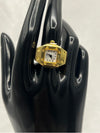 Gold-Tone Square Watch Ring with White Dial. One sizesquare face with black numerals on a white dial, this piece offers a modern twist on a classic designgold-tone watch ringsquare face ring watchstylish gold watch ring for womenelegant quartz watch ringfashion-forward timepiece jewelrygold statement ring with white dialwomen’s fashion accessory watchfunctional jewelry with gold designtrendy watch ring for womenluxury gold-tone ring watch